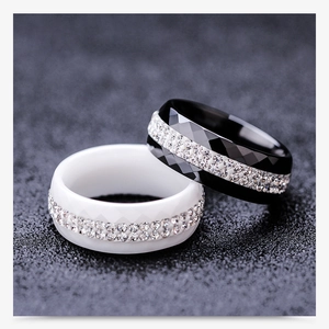 Macro shot of 8mm black and white ceramic rings with double rows of sparkling crystals