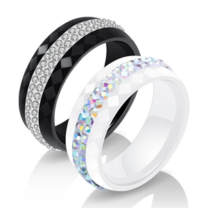 Black and white 8mm ceramic rings with diamond inlay and faceted geometric textures
