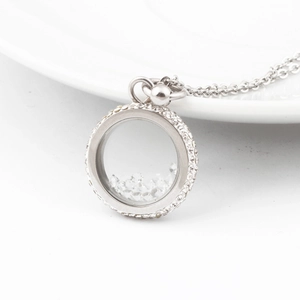 Silver floating locket necklace with sparkling crystal halo and loose stones