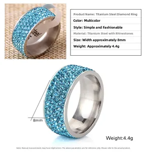 Detailed macro view of 8mm wide stainless steel ring with micro-pave blue rhinestones
