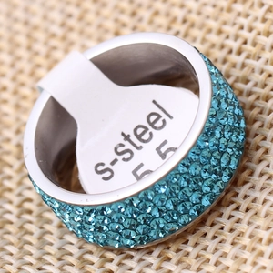 Macro detail of 8mm stainless steel ring with five rows of blue crystals on band