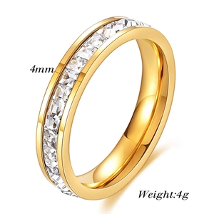 Detail view of 4mm gold ring featuring square cubic zirconia stones and 4g weight specs