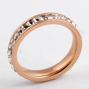 Detail of 4mm rose gold eternity ring with single row of cubic zirconia stones