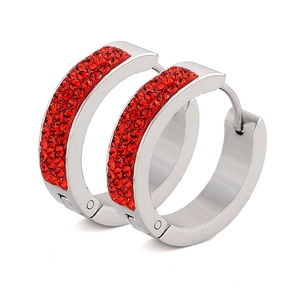Macro shot of silver hoop earrings with triple rows of red crystal pavé setting