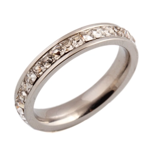 Macro detail of 4mm silver eternity ring with channel-set square-cut cubic zirconia
