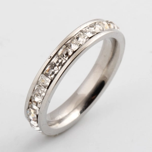 Close-up of 4mm silver ring featuring channel-set square-cut cubic zirconia stones