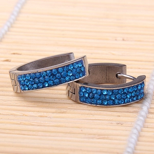Detail view of 5mm gunmetal hoop earrings with three rows of royal blue rhinestones