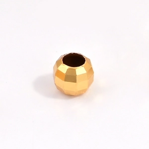 Macro detail of faceted gold-plated S925 sterling silver beads for DIY jewelry making