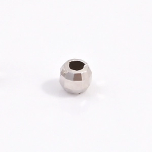 Macro shot of 925 sterling silver faceted laser bead with central hole for DIY jewelry