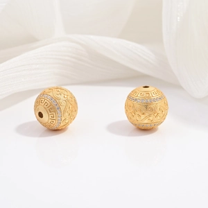 Perline in argento S925 placcate oro con zirconi e motivi incisi eleganti