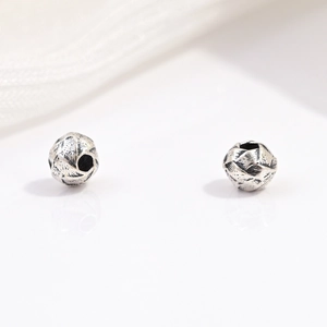 Macro detail of S925 sterling silver vintage faceted beads for DIY jewelry making