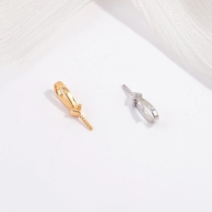 Macro detail of gold and silver S925 sterling silver screw eye pins for jewelry making