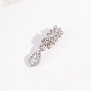 Detailed view of S925 sterling silver flower charm with zircon and pear-shaped drop