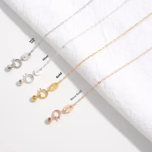 Detail of four S925 sterling silver chain colors with spring clasps and tiny hallmarks