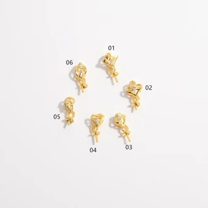 Detail of gold-plated silver floral jewelry findings with micro-set stones for DIY crafts