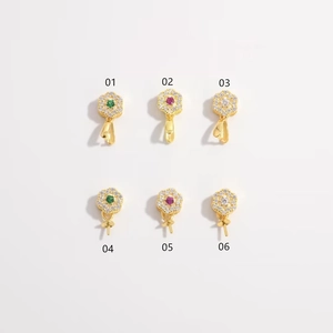 Detail view of S925 silver gold-plated flower pendants with colorful inlaid gemstones