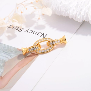 Macro shot of gold-plated cubic zirconia connector clasp for jewelry making