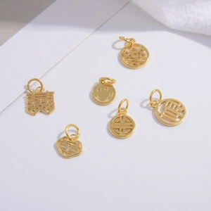 Golden Chinese lucky charms collection featuring Fu character and double happiness pendants