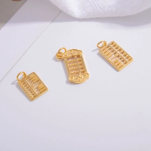 Detailed macro view of S925 silver golden abacus pendants with traditional oriental design