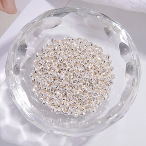 S925 sterling silver faceted geometry spacer beads in a crystal bowl for jewelry making