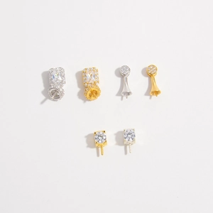 Detailed macro view of S925 silver jewelry bails in gold and platinum finishes
