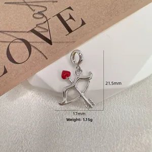 Detailed macro of S925 silver Cupid arrow pendant with red enamel heart and 21.5mm size