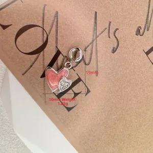 Detail of pink marble heart pendant with clear zircon crown, size 19mm by 10mm