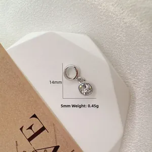 Macro view of S925 silver pendant with round clear stone and dimensions 14x5mm