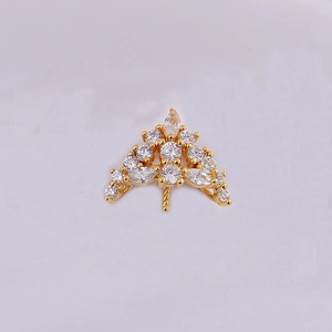 Macro detail of a gold-plated V-shaped jewelry pendant clasp set with sparkling zircons