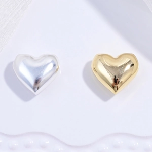 Colgantes de corazón en plata de ley S925 pulida con acabados de espejo en oro y plata