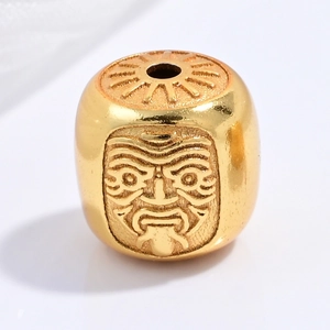 Macro shot of S925 silver golden bead featuring a carved elder face and sun pattern