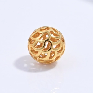 Detailed macro view of S925 silver golden镂空 spherical spacer bead for jewelry DIY crafting