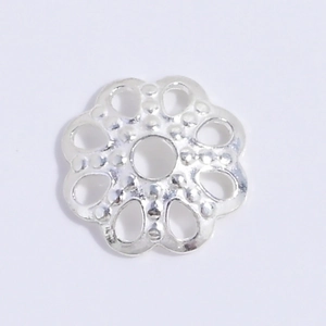 Macro detail of S925 sterling silver flower petal bead cap with intricate dot texture