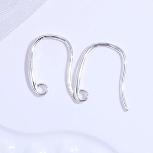 Macro shot of polished S925 sterling silver U-shaped earring hooks for DIY jewelry making
