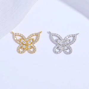 Detailed close-up of S925 silver butterfly pendant with cubic zirconia stones in gold and silver
