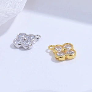 Macro shot of S925 sterling silver four-leaf clover pendants with cubic zirconia inlay