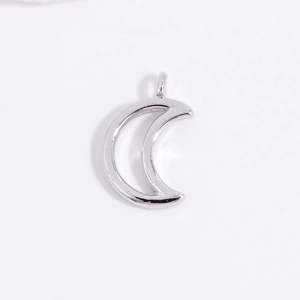 Detailed view of a polished S925 sterling silver crescent moon pendant for DIY jewelry
