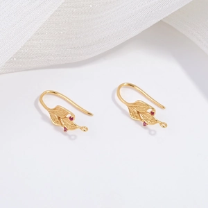 Detailed close-up of S925 silver willow leaf ear hooks with red zircon accents