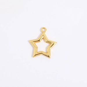 Macro shot of gold-plated hollow star pendant with jump ring for jewelry making