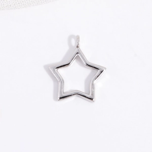 Macro shot of silver S925 sterling silver hollow star pendant with circular bail loop