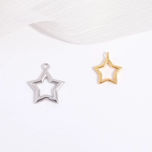 Close-up of S925 sterling silver hollow star pendants in gold and silver finishes
