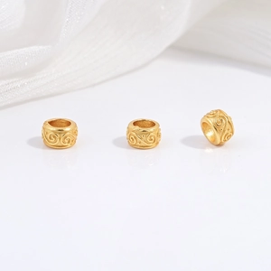 Detailed view of three gold-plated S925 silver beads with vintage engraved cloud patterns