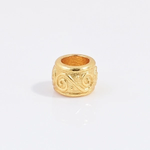 Detailed macro view of S925 sterling silver gold-plated feather pattern cylinder bead