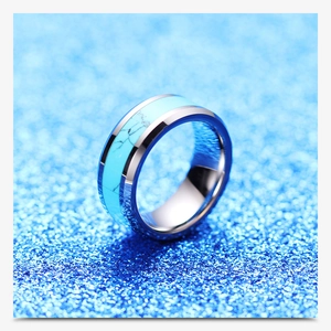 Polished 8mm stainless steel ring with turquoise inlay on a sparkling blue background