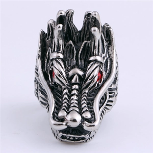 Vintage stainless steel dragon head ring with detailed scales and red crystal eyes