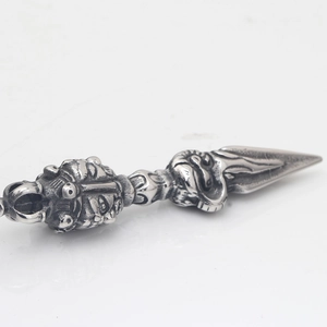 Tibetan Vajra Phurba pestle pendant necklace in oxidized stainless steel, diagonal view
