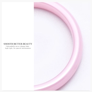 Detail of a smooth 3mm pink ceramic ring band showing its high-gloss and durable finish