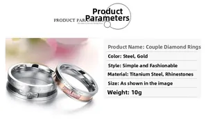 Close-up of titanium steel couple rings with rhinestones and love letter engraving