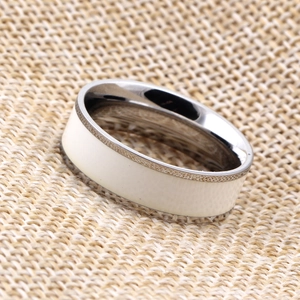 Detail of 7mm stainless steel ring featuring white enamel inlay and anti-slip texture