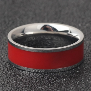 Macro view of 7mm stainless steel ring with vibrant red enamel inlay and polished edges